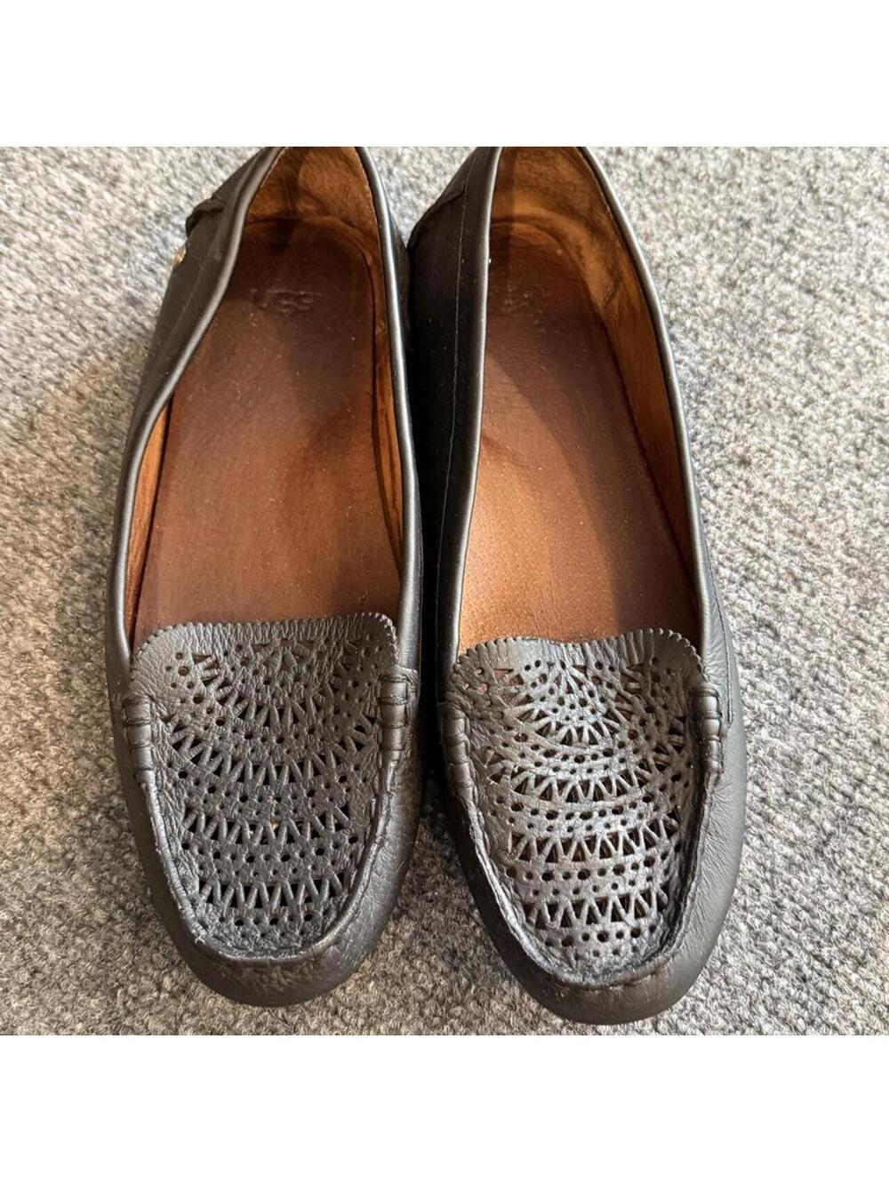 UGG black leather loafers with perforated geometric pattern, size US 9.5